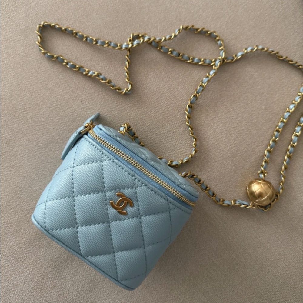 CHANEL Light Blue Quilted Mini Bag with Gold Accents